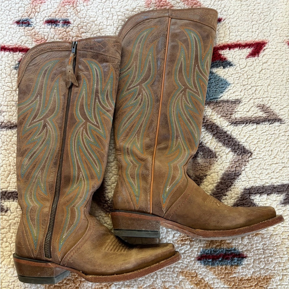 In good used shape, taller boot that hits under the knee